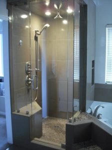 Modern bathroom with glass shower and tub.